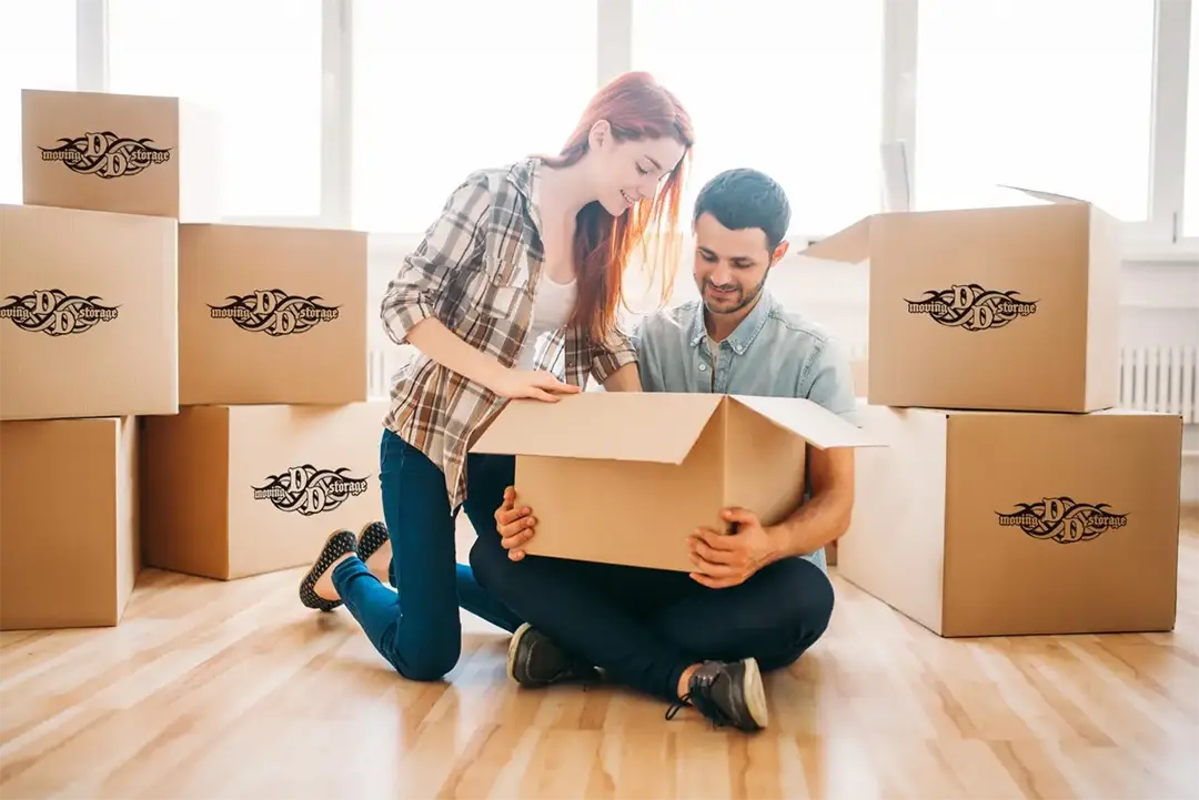 Couple unpacking boxes