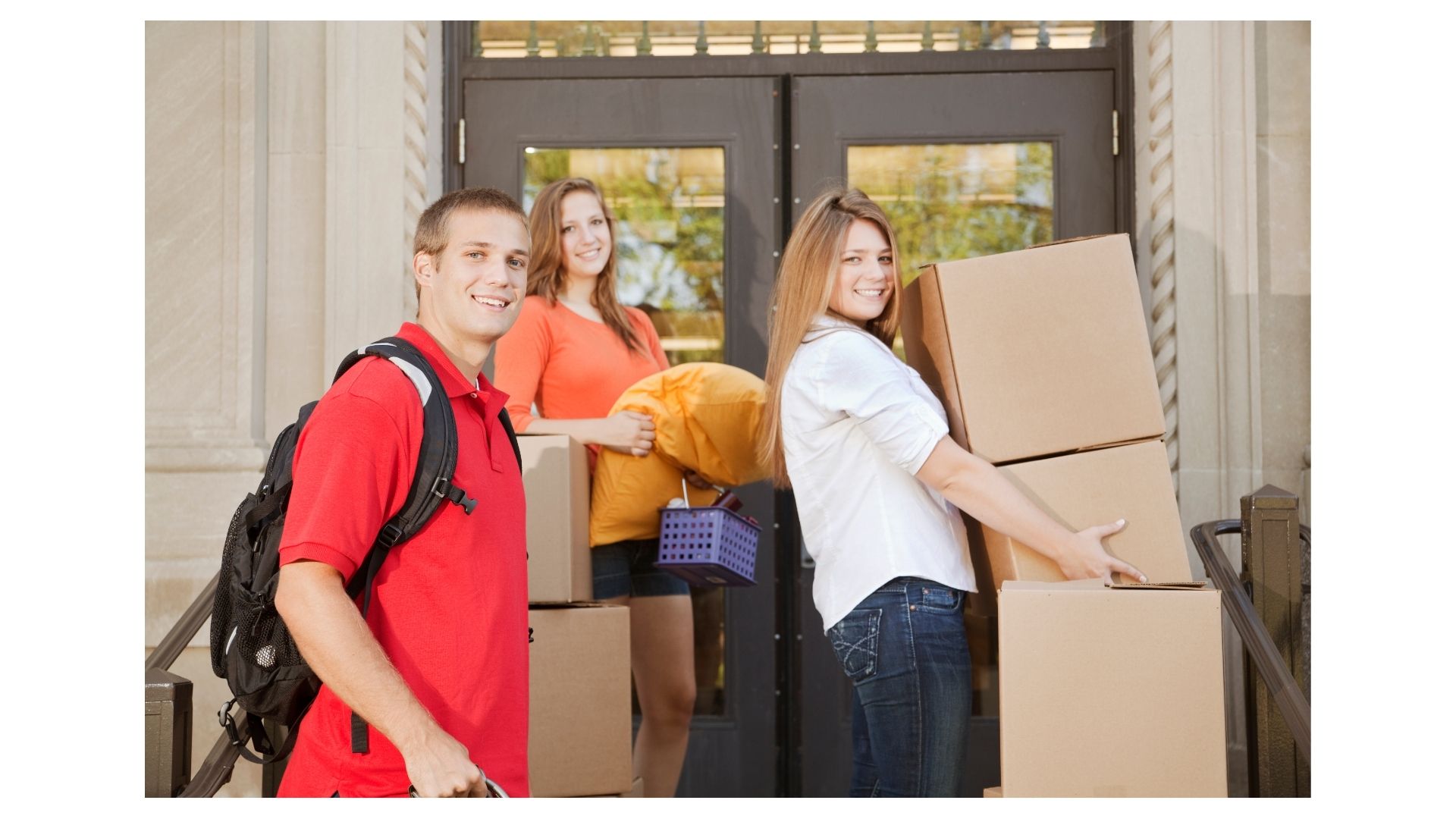 College students moving boxes into a residence hall in College Station, TX